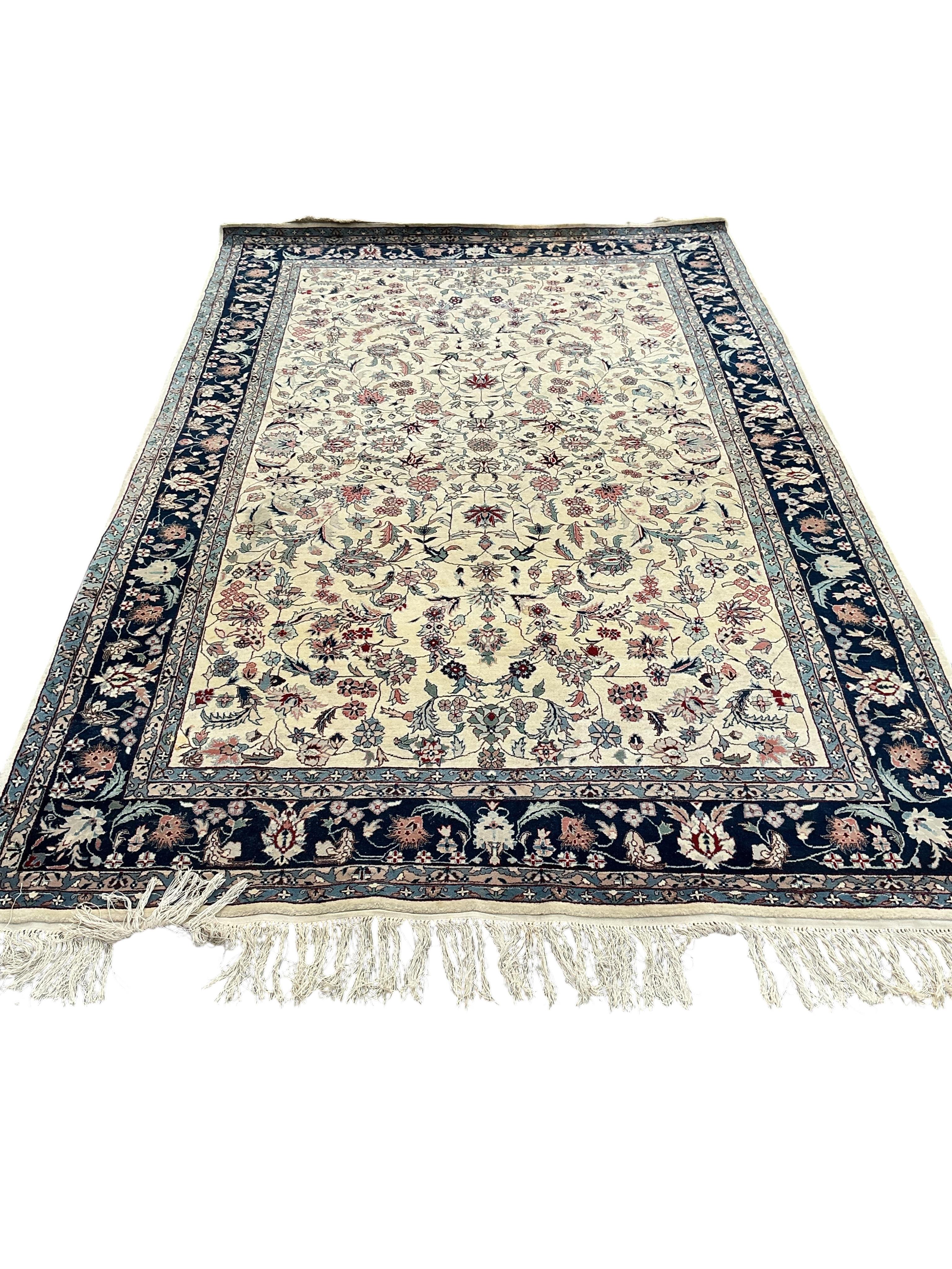 A Tabriz ivory ground floral rug, 240 x 150cm